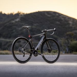 Giant Defy E+ Elite with sunset in background.